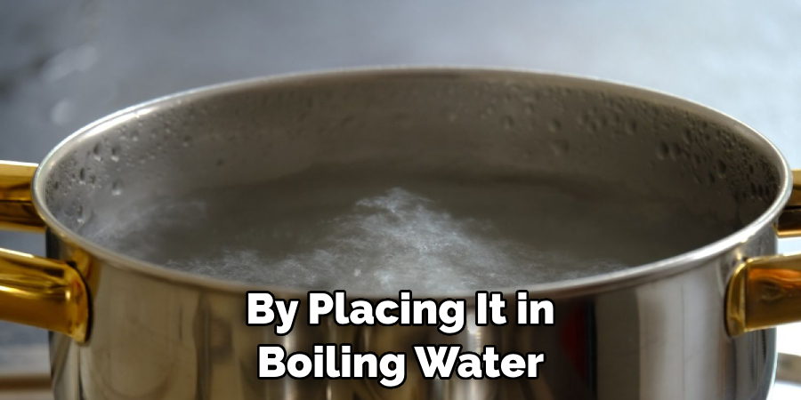 By Placing It in Boiling Water