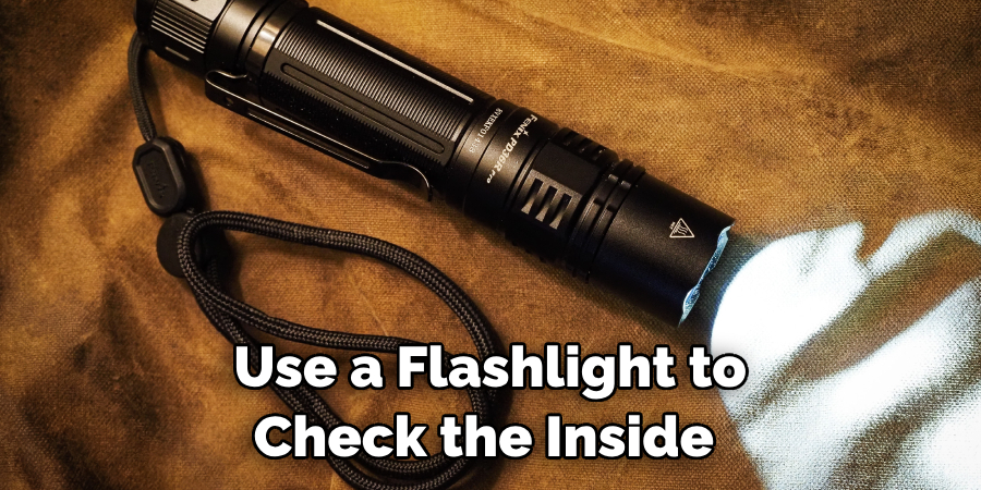 Use a Flashlight to Check the Inside