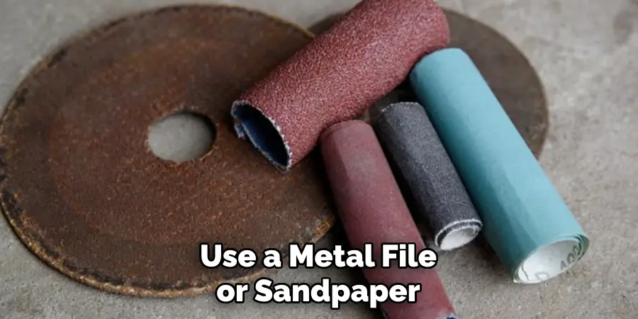 Use a Metal File or Sandpaper