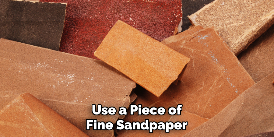 Use a Piece of Fine Sandpaper
