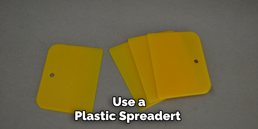 Use a Plastic Spreadert 