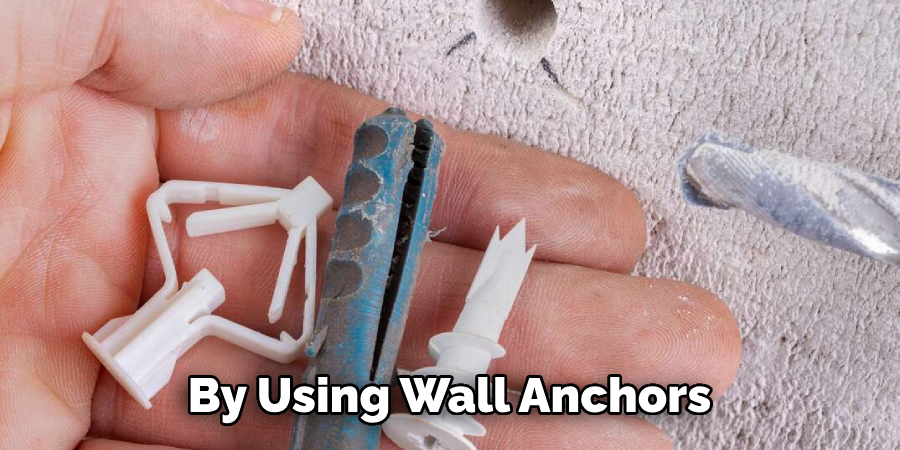 By Using Wall Anchors