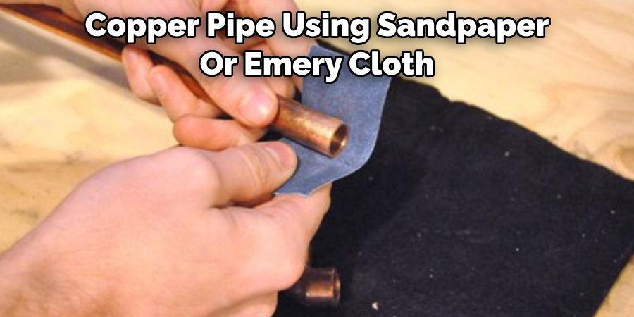 Copper Pipe Using Sandpaper 
Or Emery Cloth