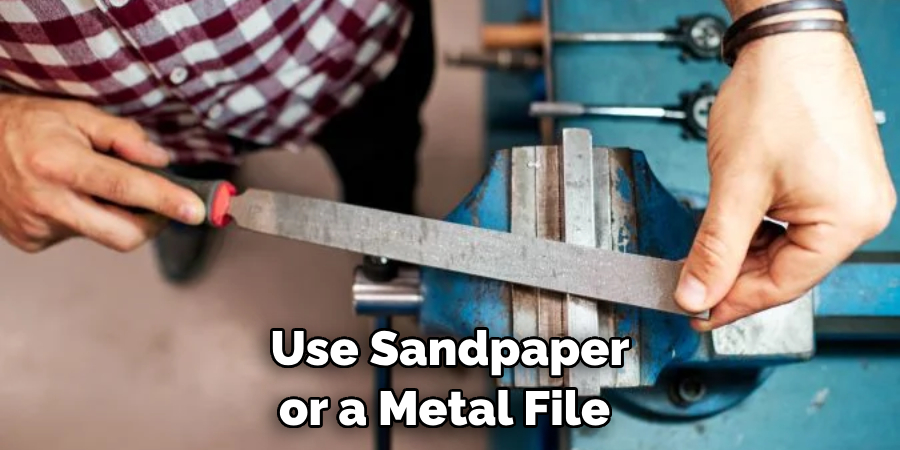 Use Sandpaper or a Metal File 