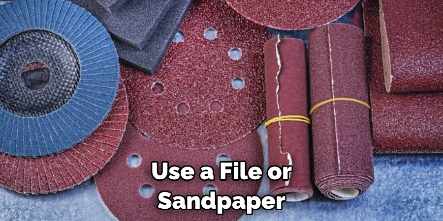 Use a File or Sandpaper