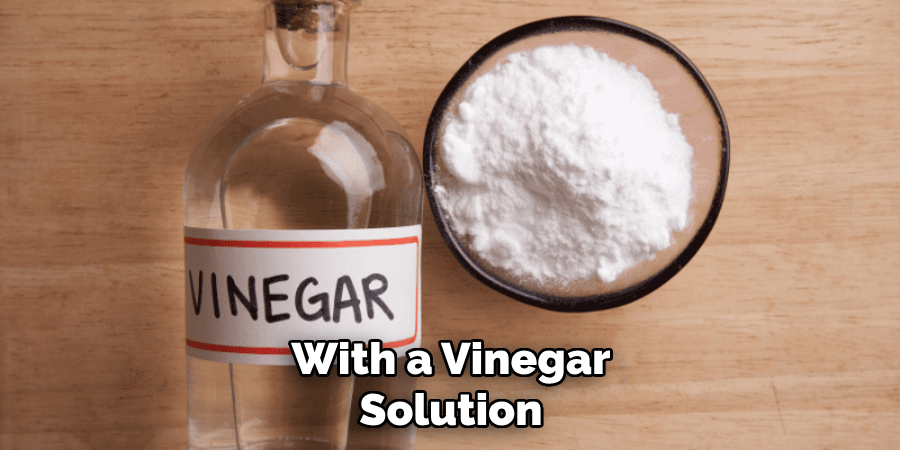 With a Vinegar Solution