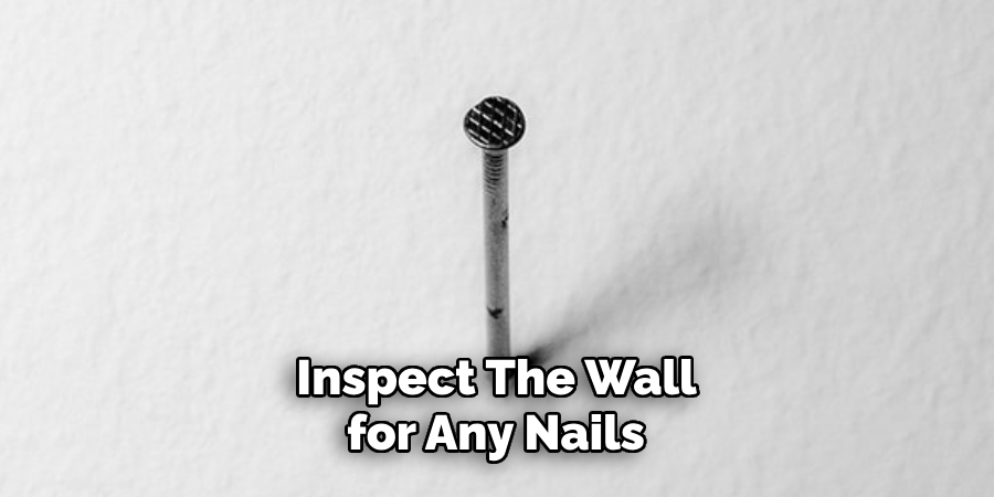 Inspect the Wall for Any Nails 