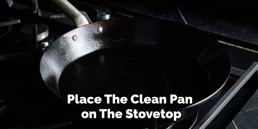 Place the Clean Pan on the Stovetop