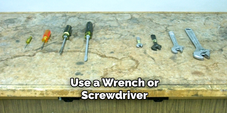 Use a Wrench or Screwdriver