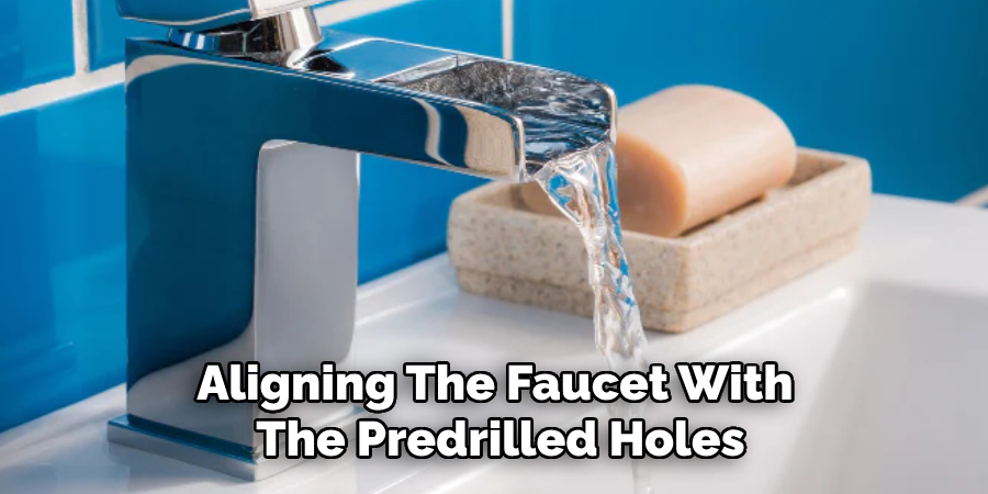 Aligning the Faucet With the Predrilled Holes