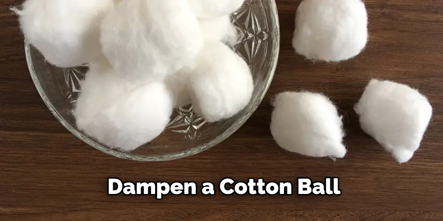 Dampen a Cotton Ball