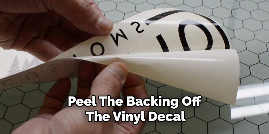 Peel the Backing Off the Vinyl Decal