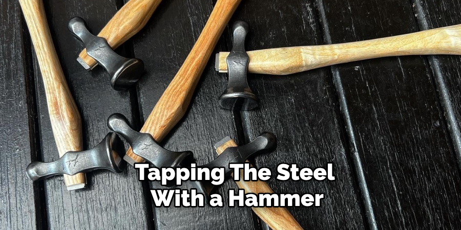 Tapping the Steel With a Hammer