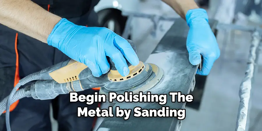 Begin polishing the metal by sanding