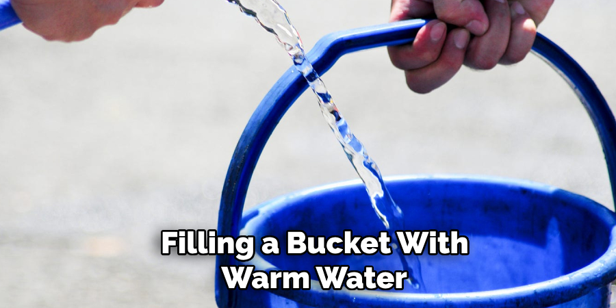 Filling a Bucket With Warm Water