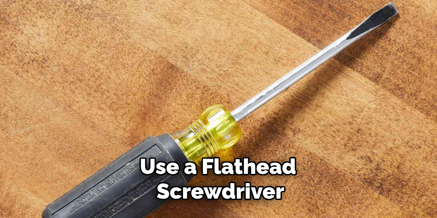 Use a Flathead Screwdriver