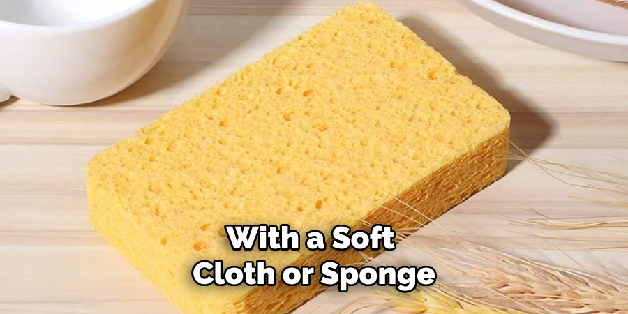 With a Soft Cloth or Sponge