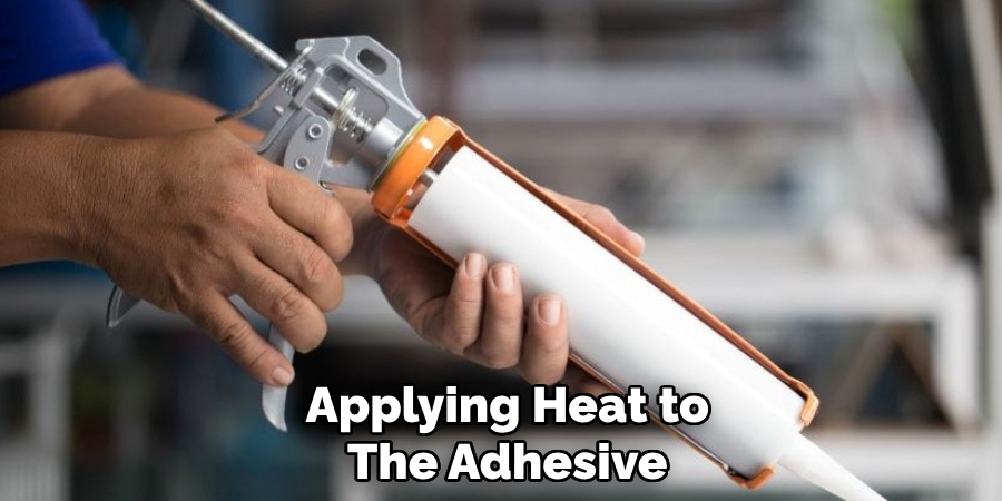 Applying Heat to
The Adhesive   