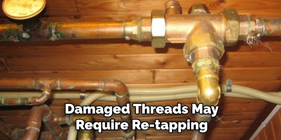Damaged Threads May
Require Re-tapping