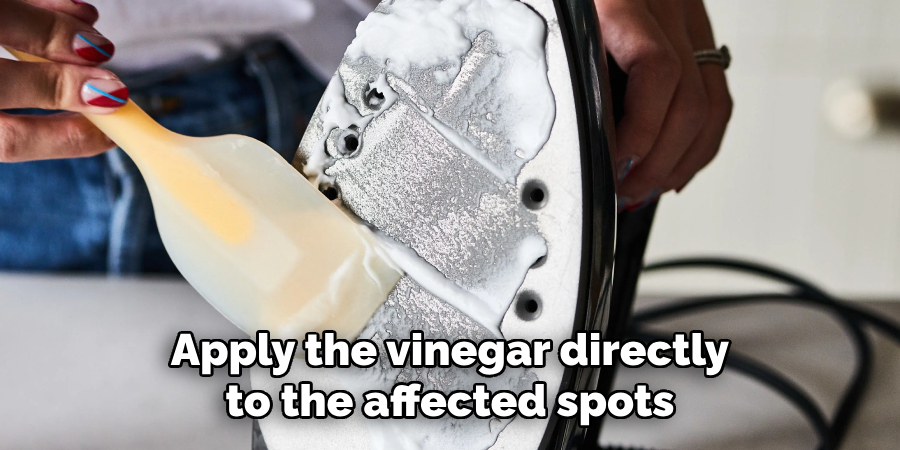 Apply the vinegar directly to the affected spots