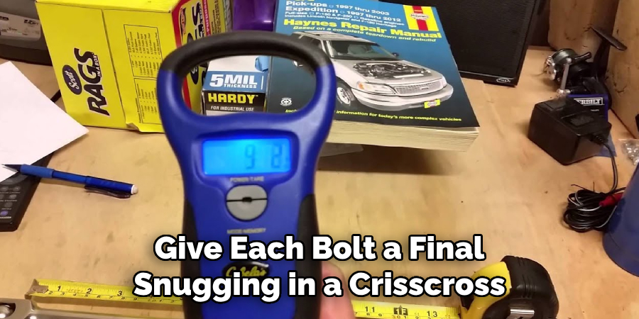 Give Each Bolt a Final Snugging in a Crisscross