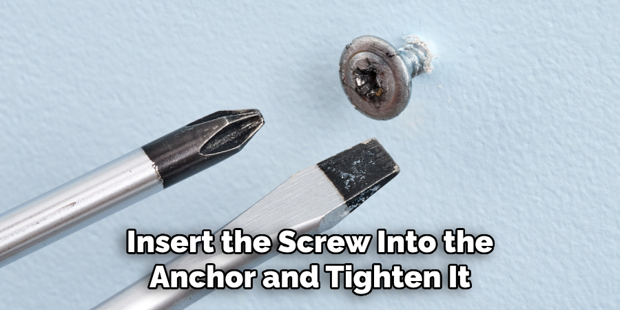 Insert the Screw Into the Anchor and Tighten It
