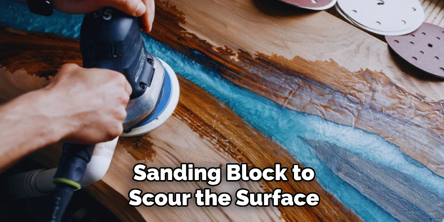 Sanding Block to
Scour the Surface