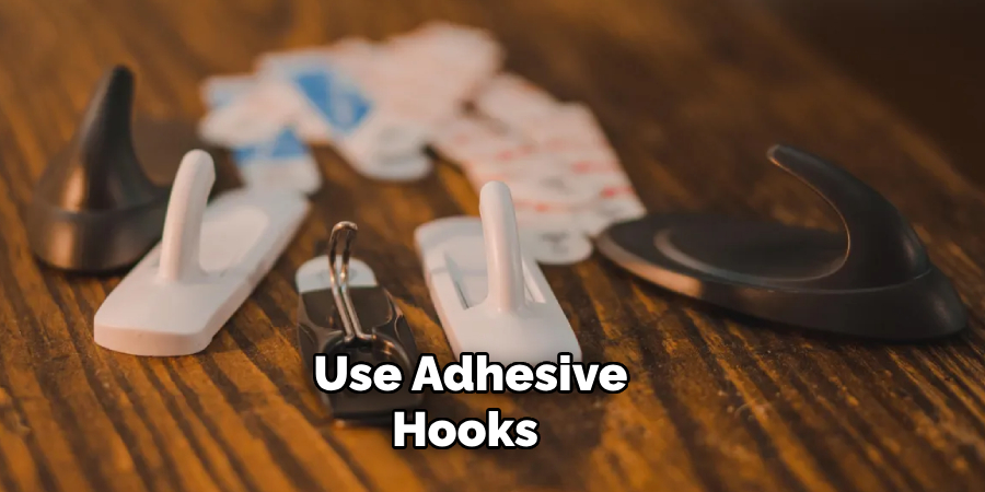 Use Adhesive Hooks