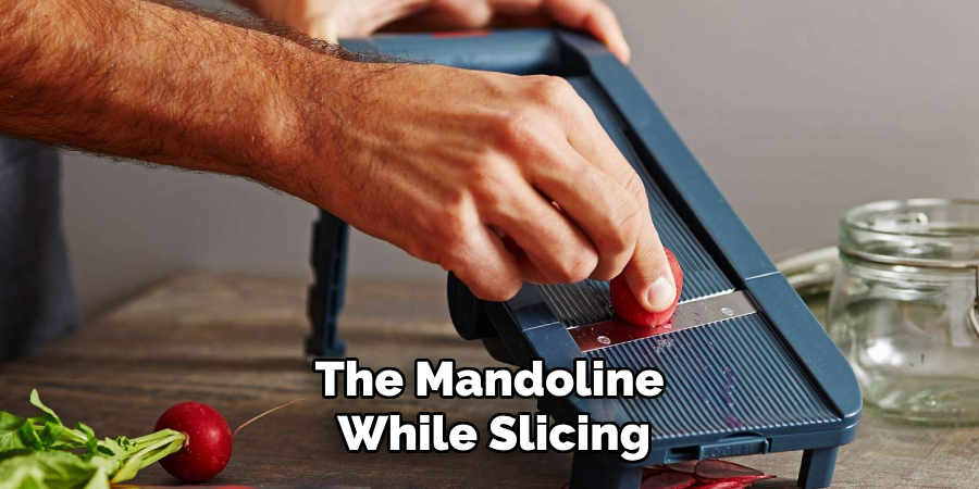 the mandoline while slicing