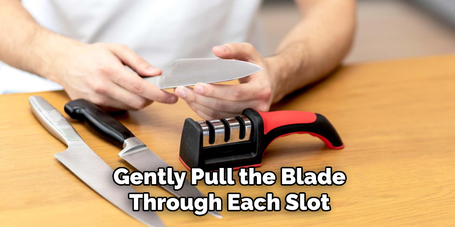 gently pull the blade through each slot