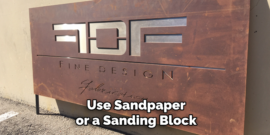 Use Sandpaper or a Sanding Block