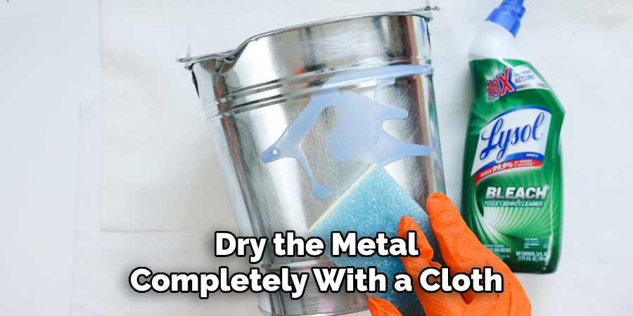 Dry the Metal Completely With a Cloth