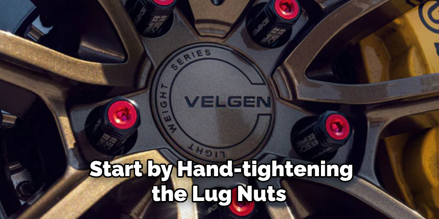 Start by Hand-tightening the Lug Nuts