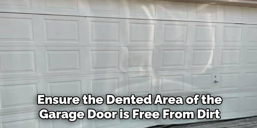 Ensure the Dented Area of the Garage Door is Free From Dirt