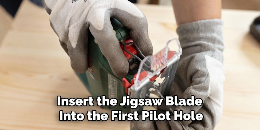 Insert the Jigsaw Blade Into the First Pilot Hole