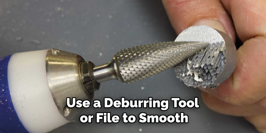 Use a Deburring Tool or File to Smooth